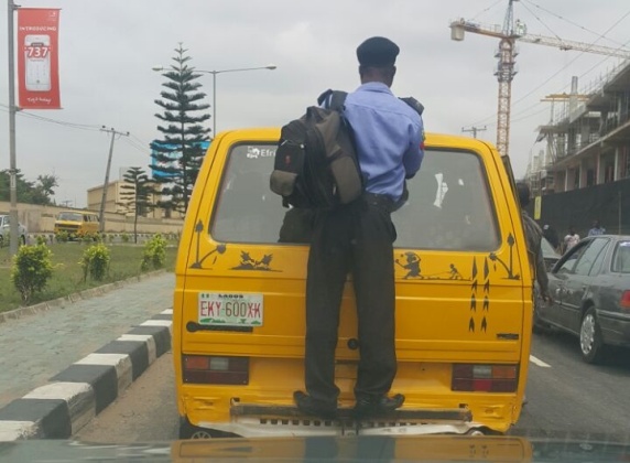 Image result for police man on danfo buses in lagos